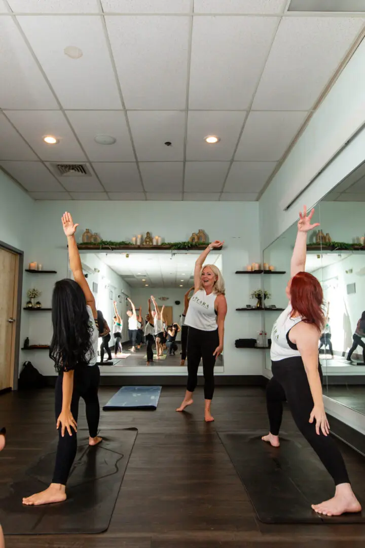 Group of women stretching in yoga studio