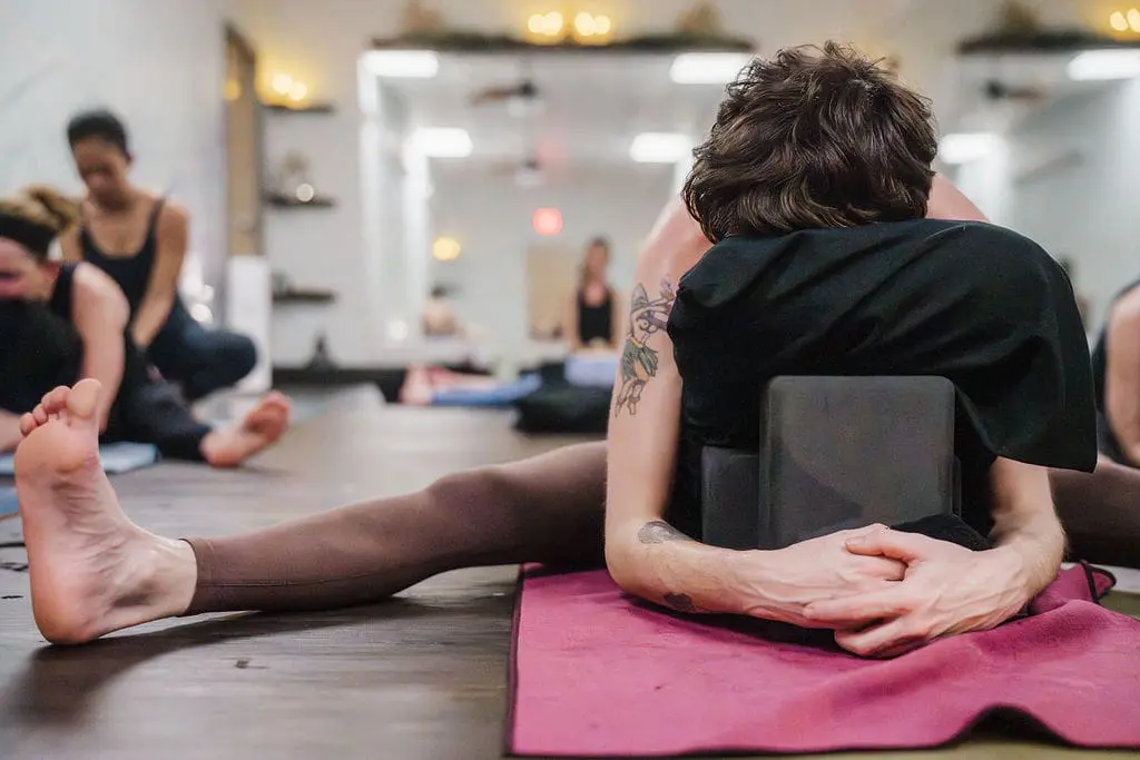 Students practicing inside the heated room at Vitara Hot Yoga in Seabrook New Hampshire
