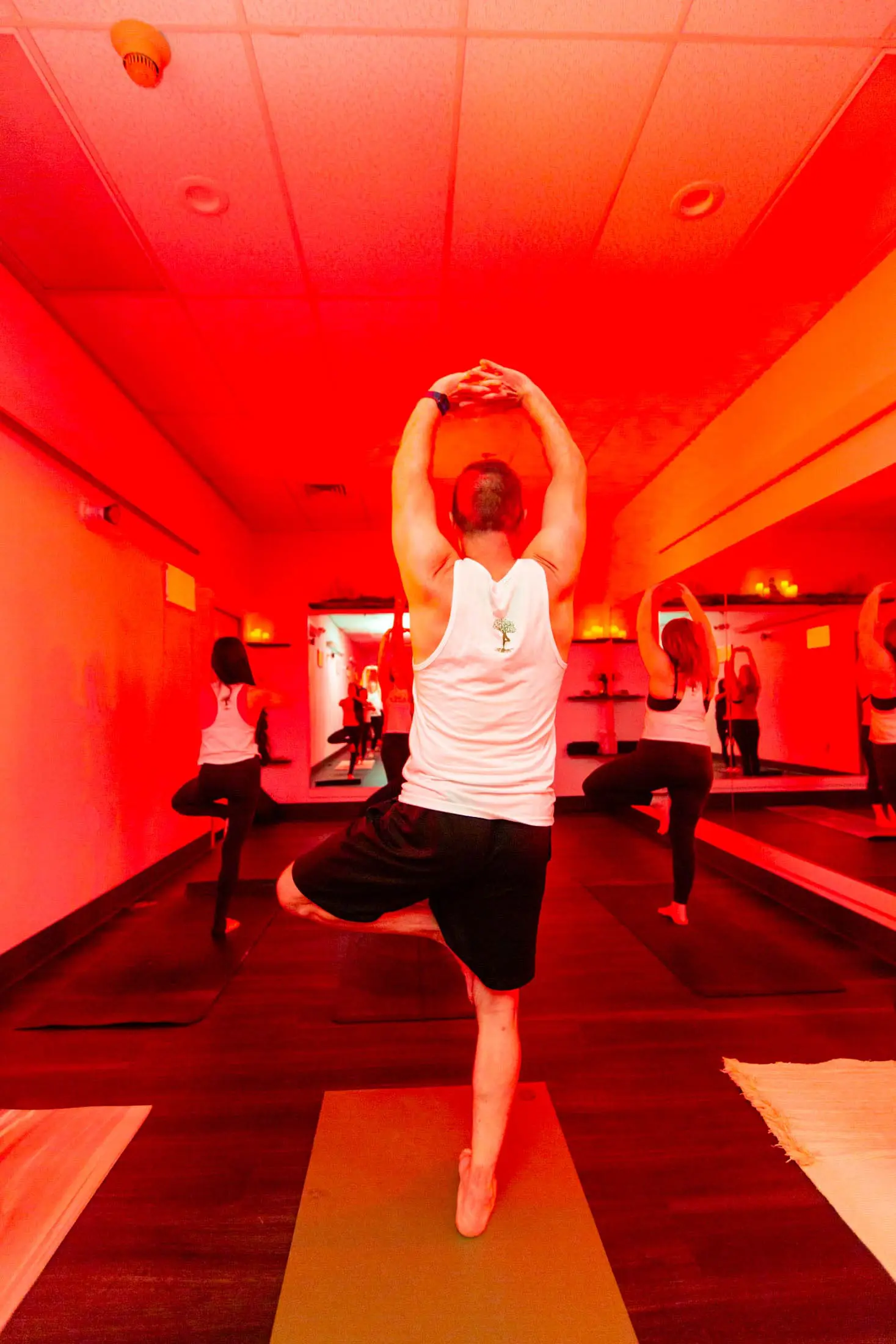 Red and green light class atmosphere at Vitara Hot Yoga