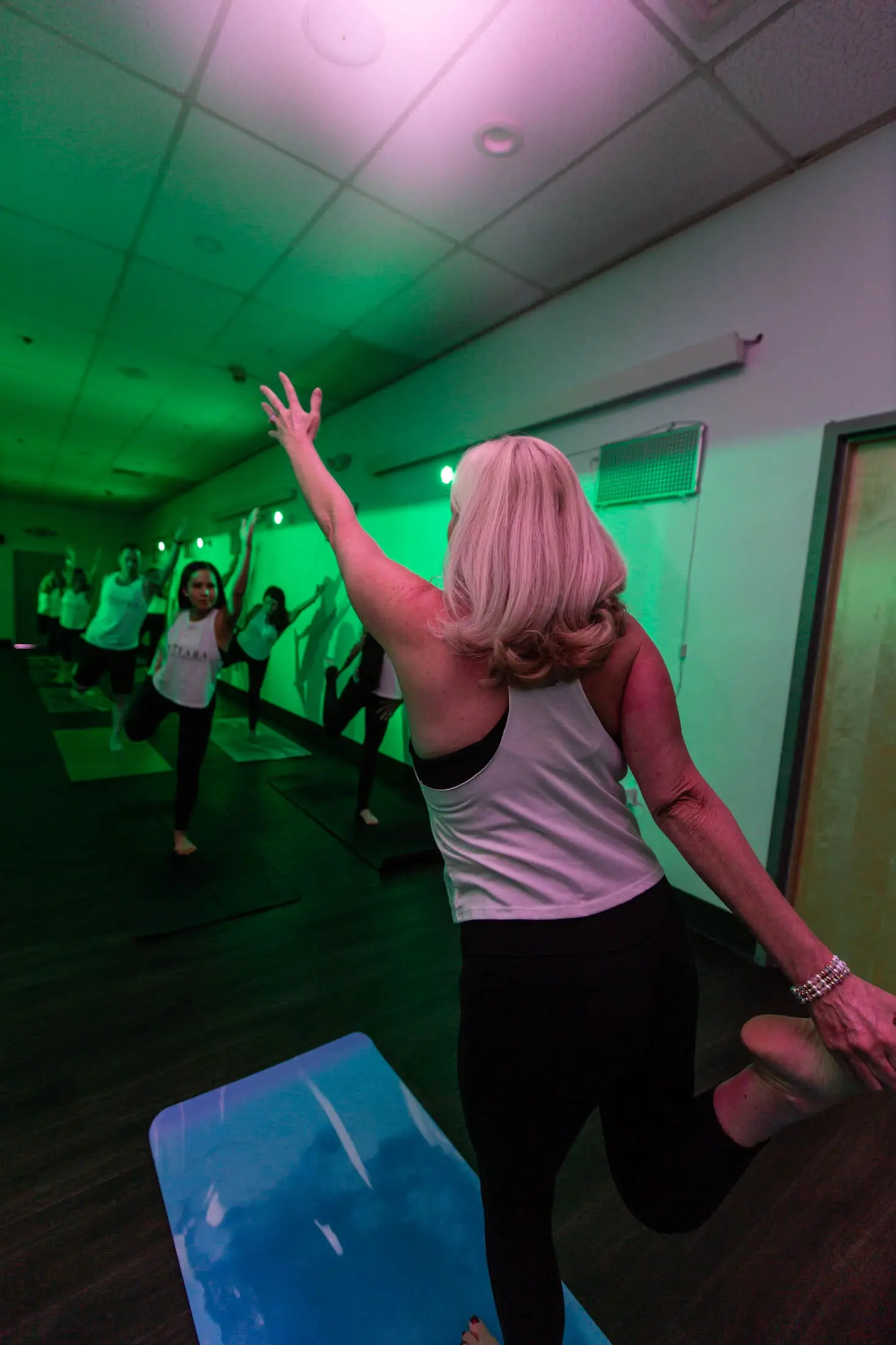 Red and green light atmosphere inside Vitara Hot Yoga