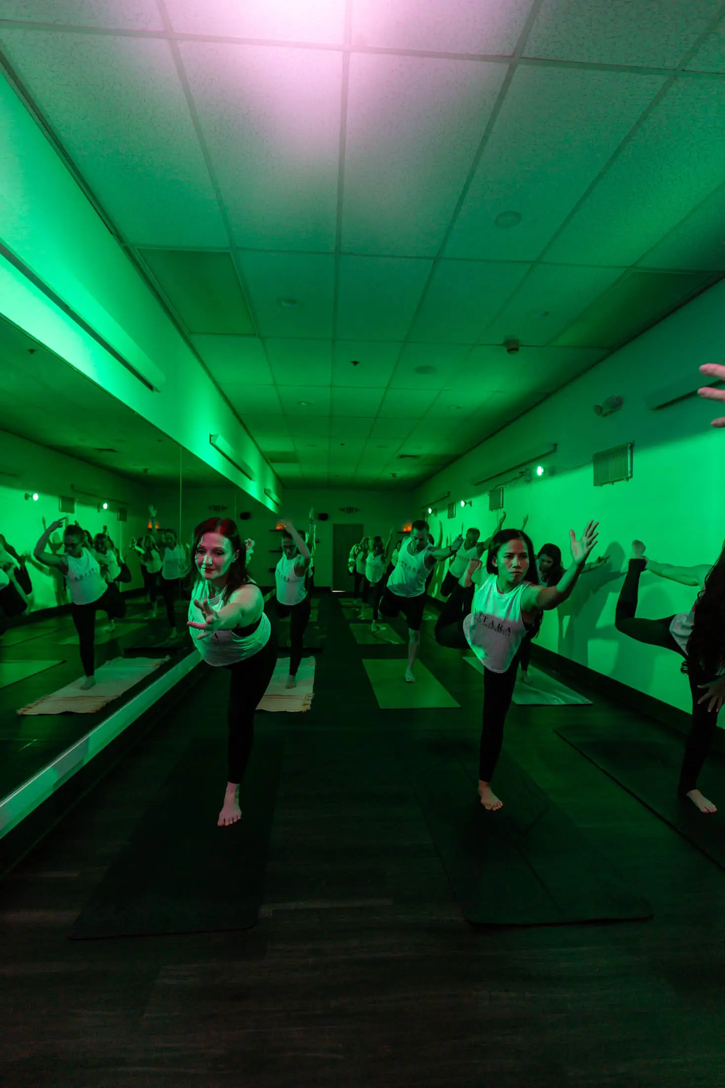 Red and green light studio atmosphere at Vitara Hot Yoga