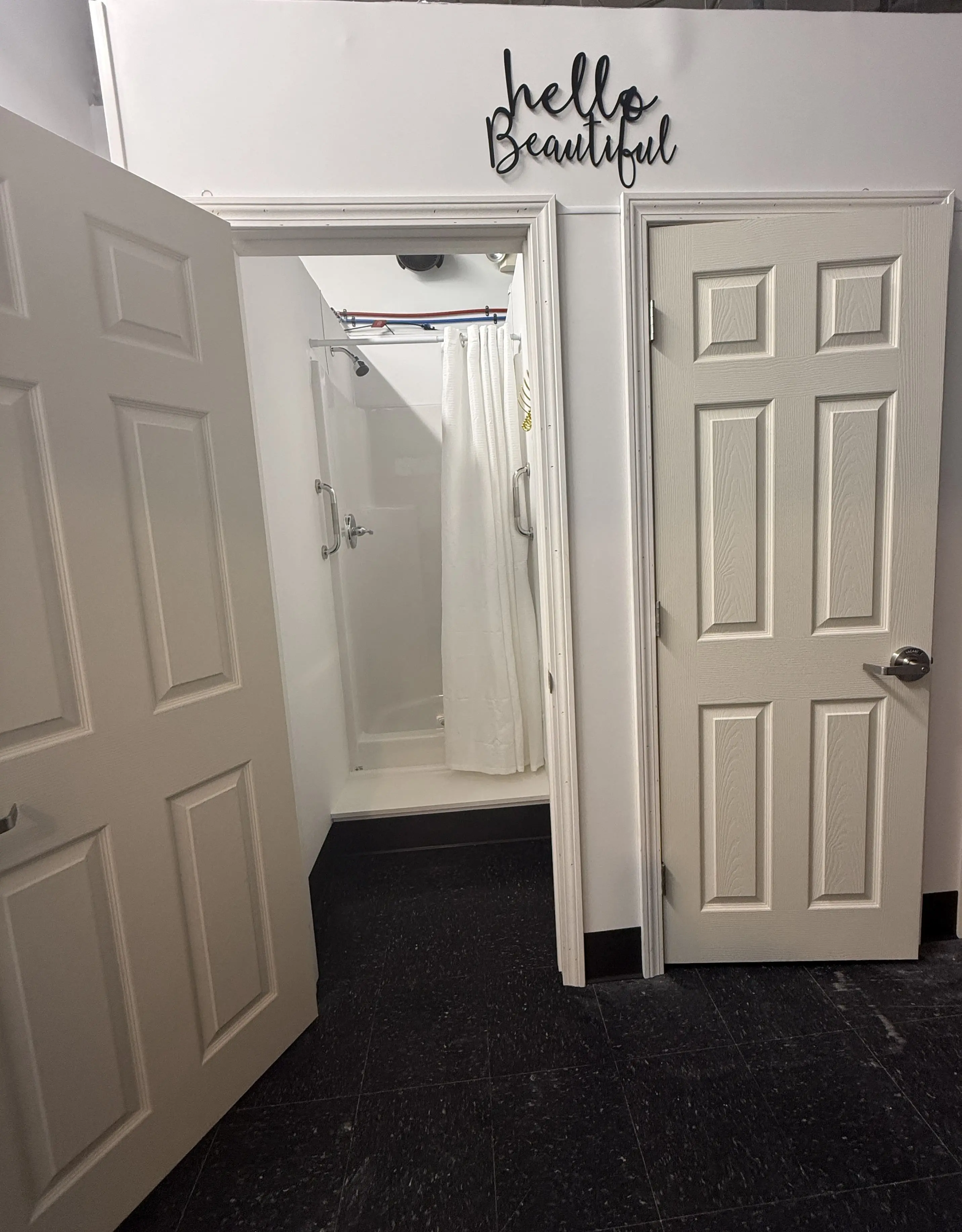 Thoughtful studio amenities and shower details at Vitara Hot Yoga