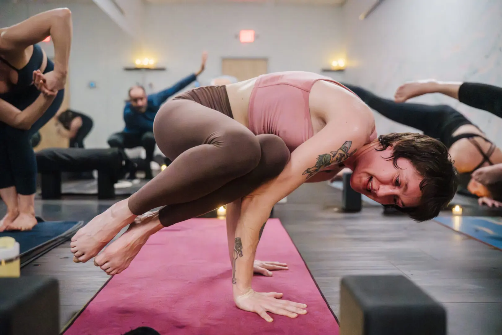 Students practicing hot yoga inside Vitara Hot Yoga in Seabrook New Hampshire